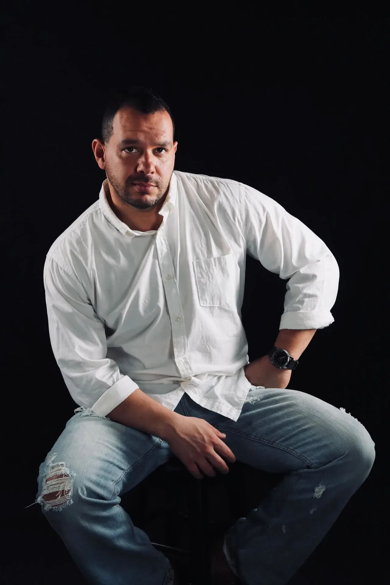 Studio portrait of Wilson “Stryke” Machado Jr., firearms instructor and protective specialist