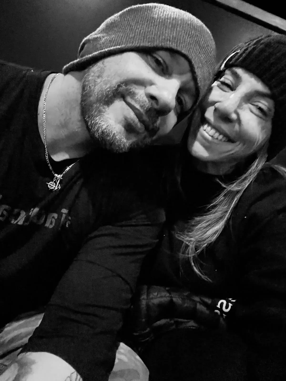 Wilson and his wife in beanies, black-and-white photo