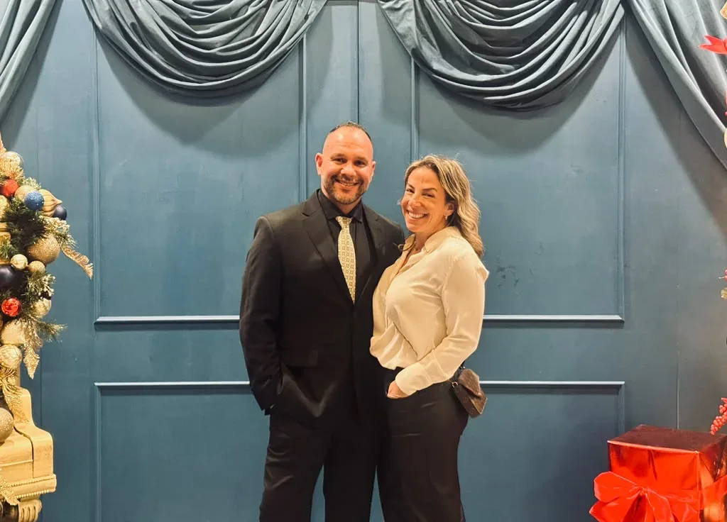 Wilson and his wife dressed up at a holiday event