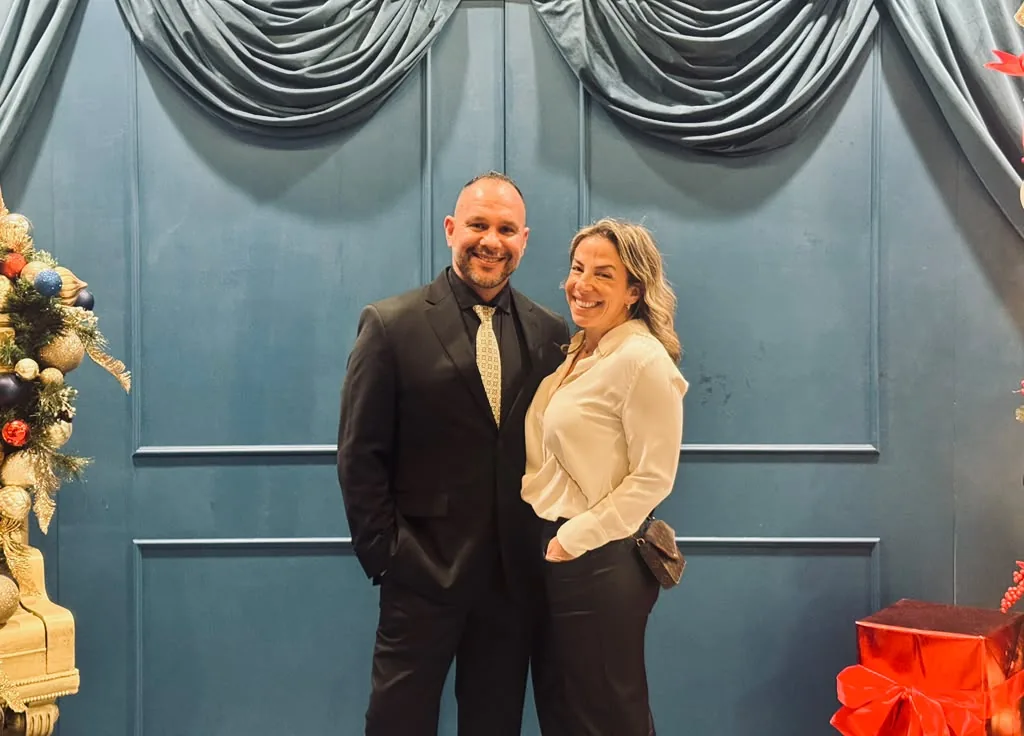 Wilson and his wife dressed up at a holiday event